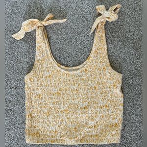 Yellow and white patterned American Eagle cropped tank top with bows